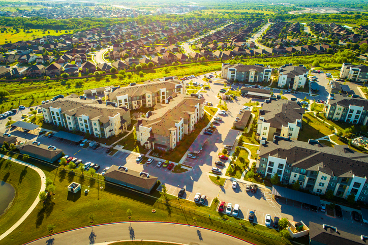 Golden Sunrise over Apartments and Suburbs in Austin Texas aerial drone view